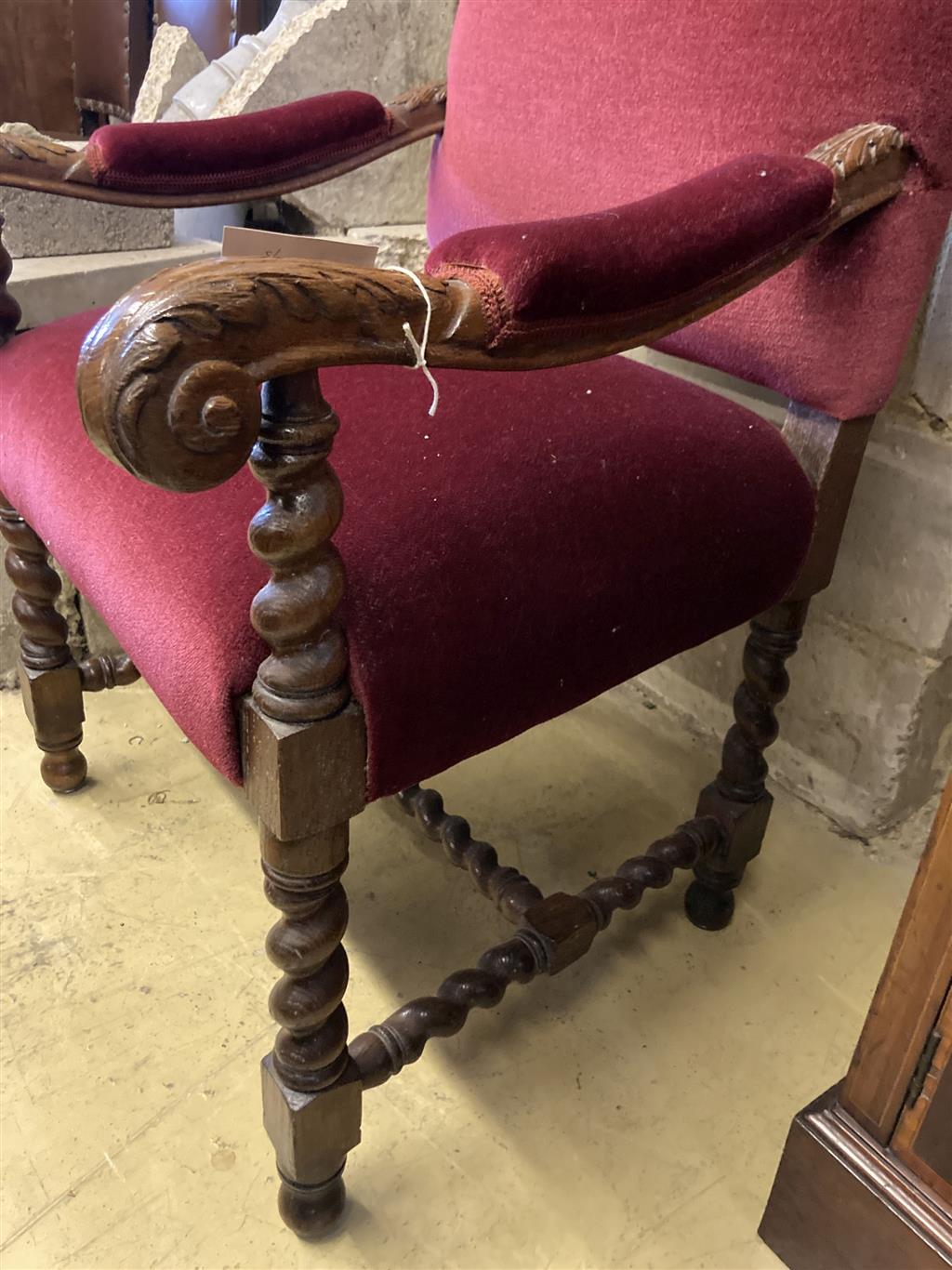 A carved oak Carolean design elbow chair, width 64cm, depth 70cm, height 110cm